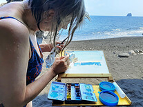 Malování výhledu z jeskyně na pláži