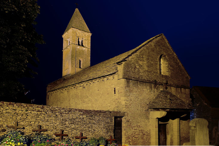 The night in Taizé, reflectors are shining onto the old church